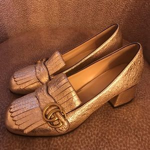 Gucci metallic loafers.